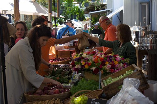 Woman selling fresh produce at local market