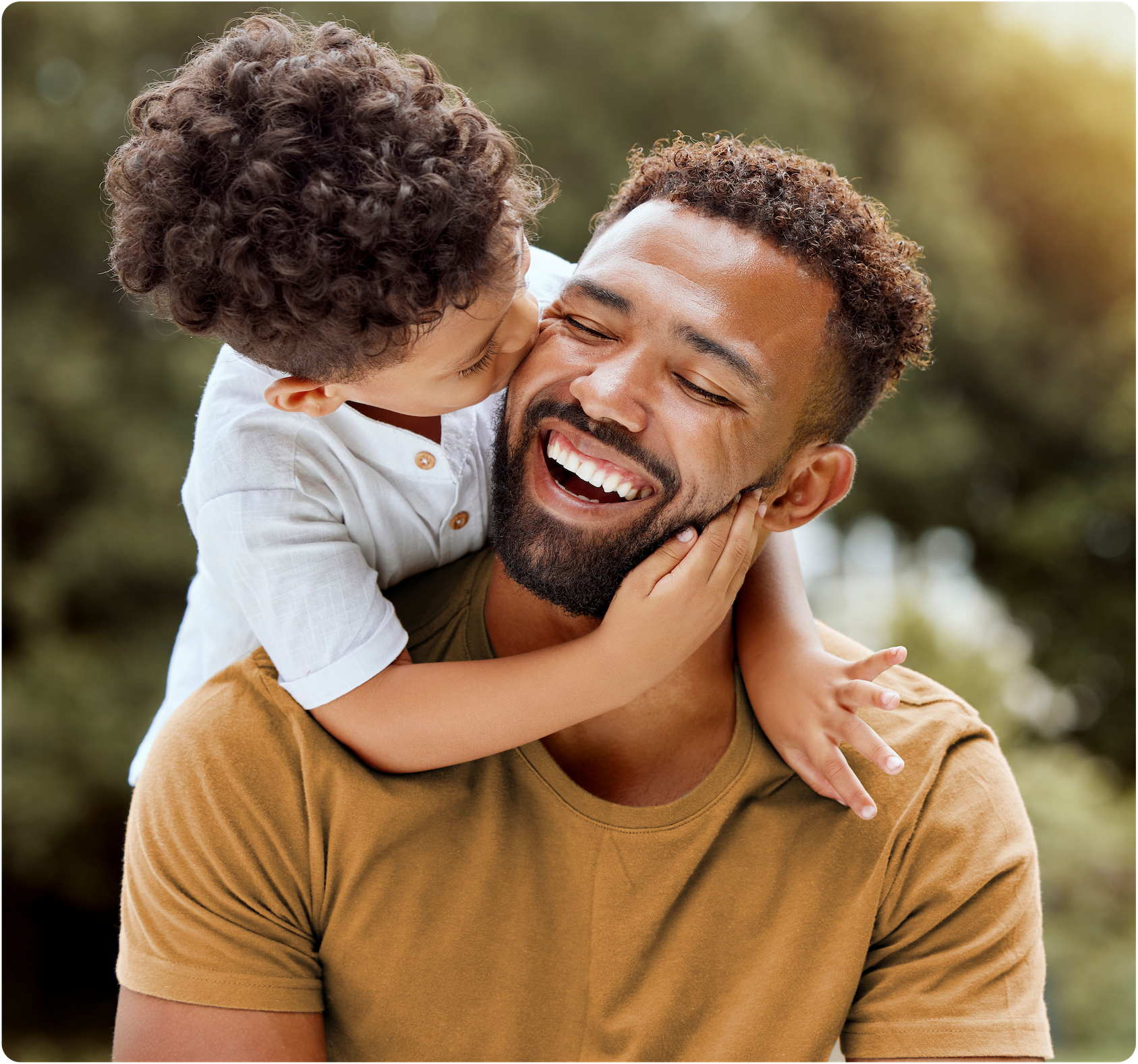 Boy on his smiling father's shoulders