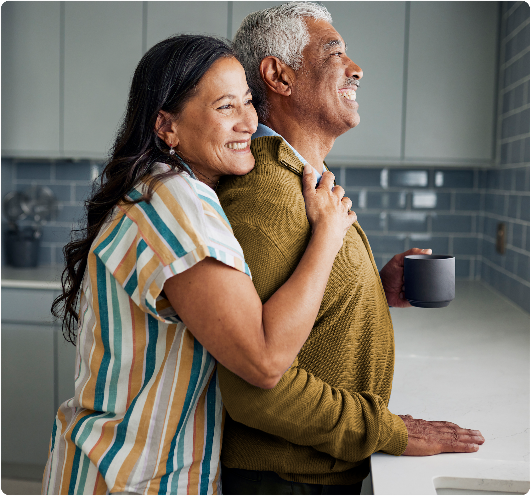 Woman giving man a hug from behind