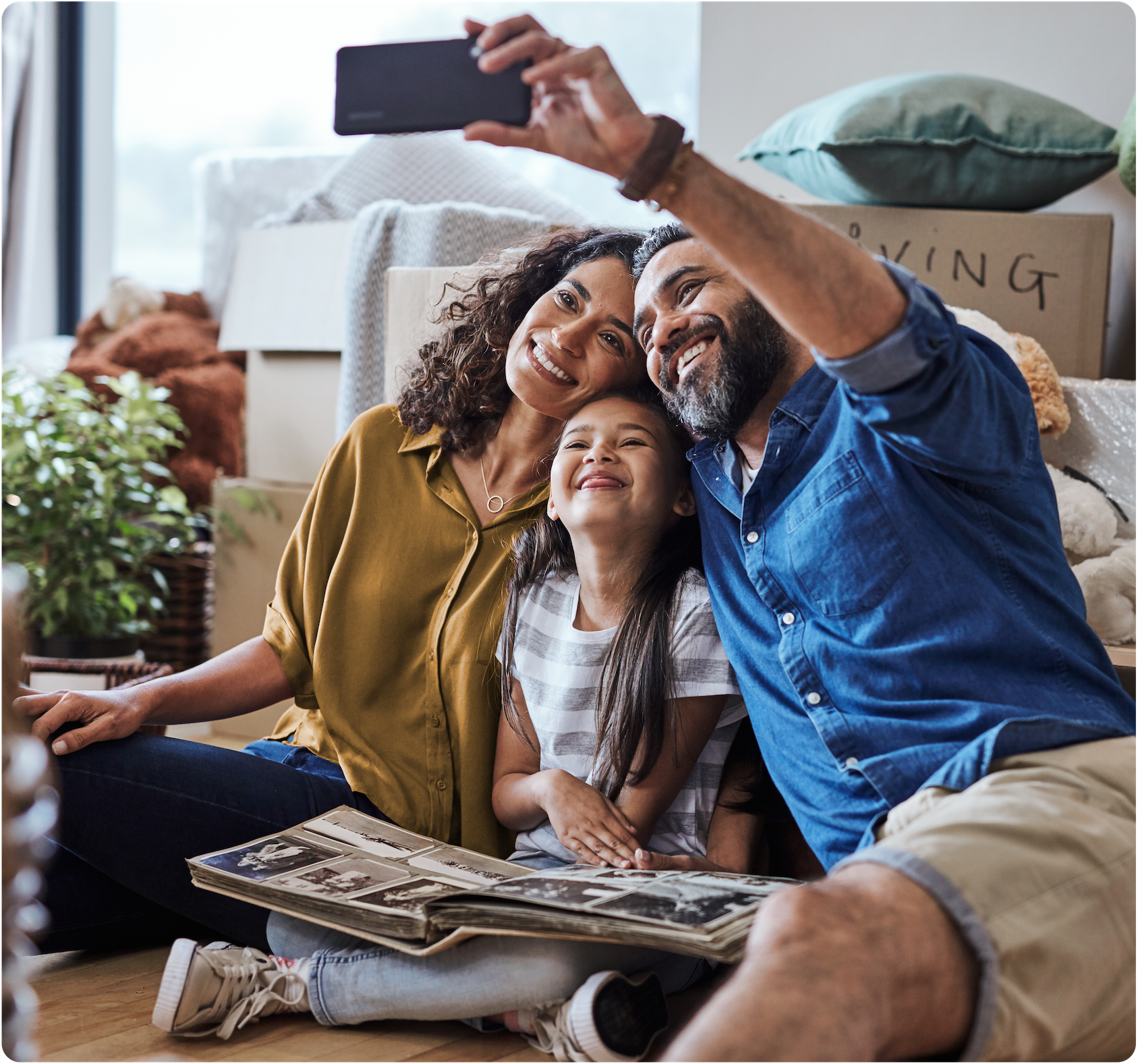 Man and woman taking a selfie with their child