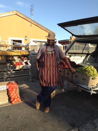 Trader standing in front of his stall